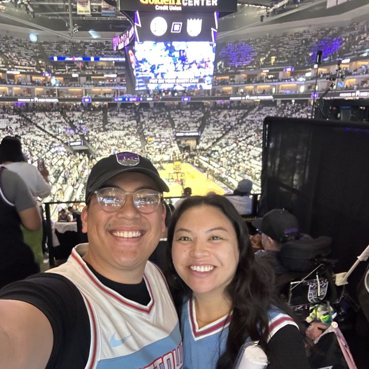 Matt and his partner in Kings gear at a Sacramento Kings game
